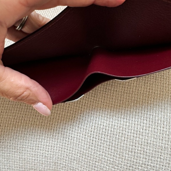 Cartier wallet. NWOT Brown exterior, burgundy interior. Shopping bag included. - Picture 9 of 10